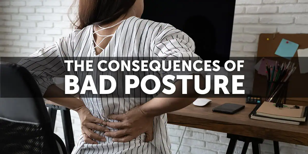 The consequences of bad posture Woman holding her lower back from bad posture at a desk | Needa Massage Rockingham